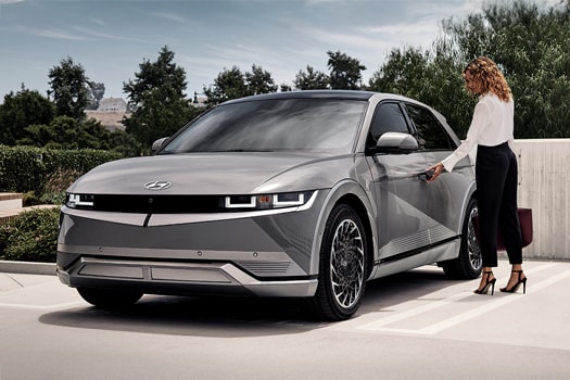 Woman standing next to Hyundai IONIQ 5