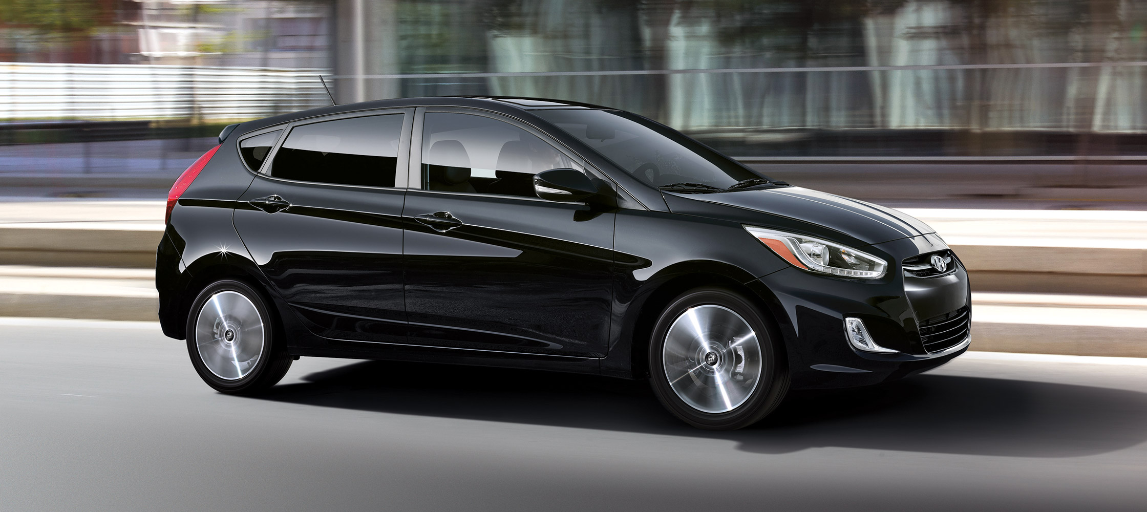 Exterior photo of black Hyundai Accent hatchback 2017 five door sedan