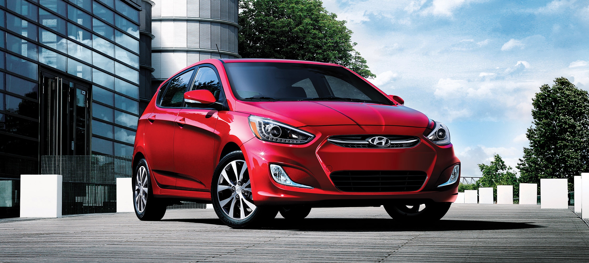 Exterior sleek front photo of Red Hyundai Accent compact five door ...