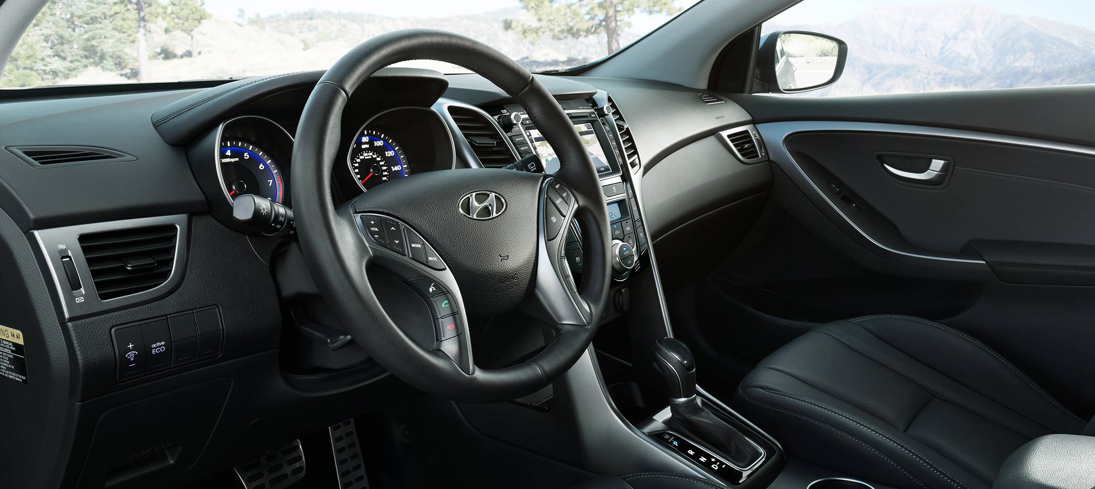 Interior photo of Hyundai Elantra GT multi-touch navigation screen, steering wheel and high-tech dashboard