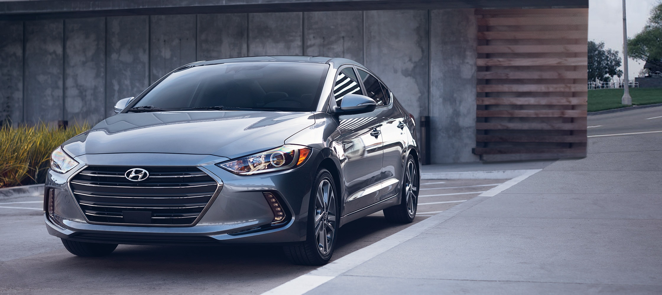 photo of grey Hyundai Elantra V3 2017 front grill, sleek headlights, and side door