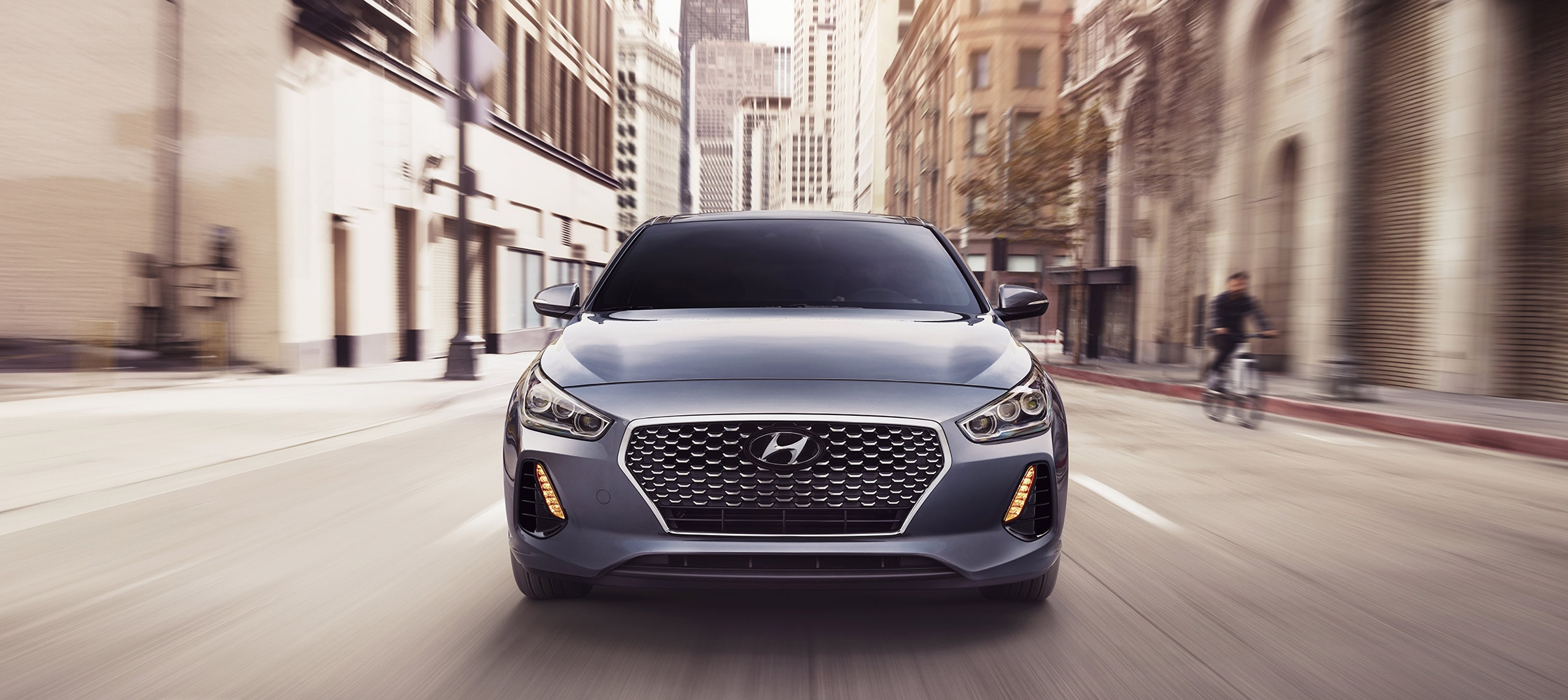 Front shot of Hyundai 2018 Elantra GT driving on a road