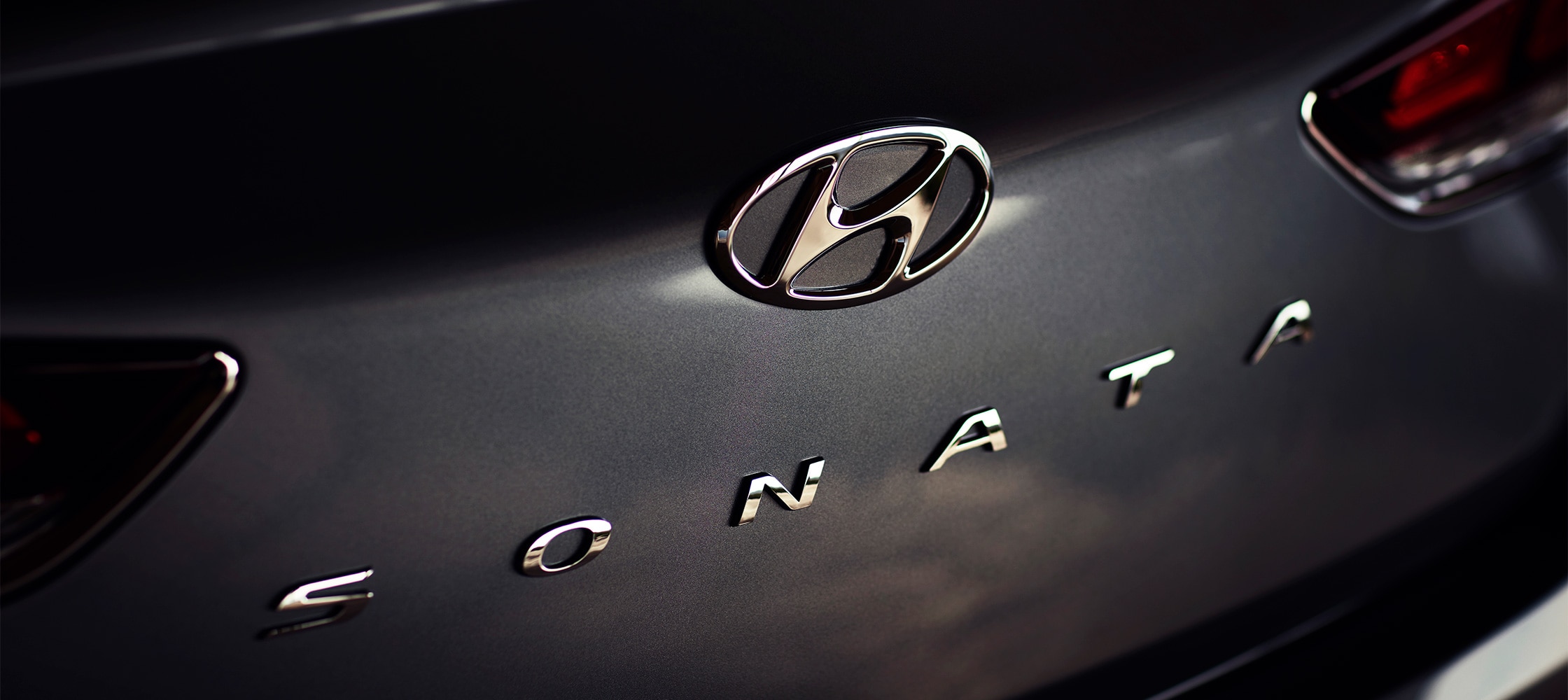 Closeup of the Hyundai 2018 Sonata logo on the car trunk.