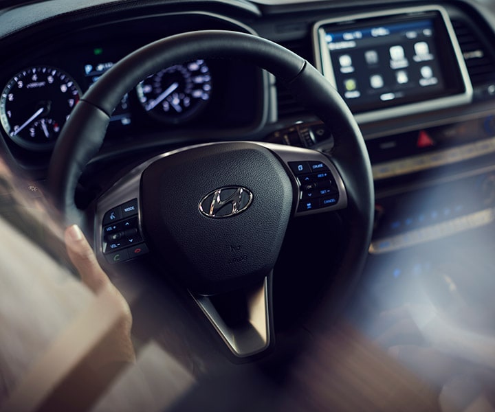 Driver seat view of the heated steering wheel of the Hyundai 2018 Sonata.
