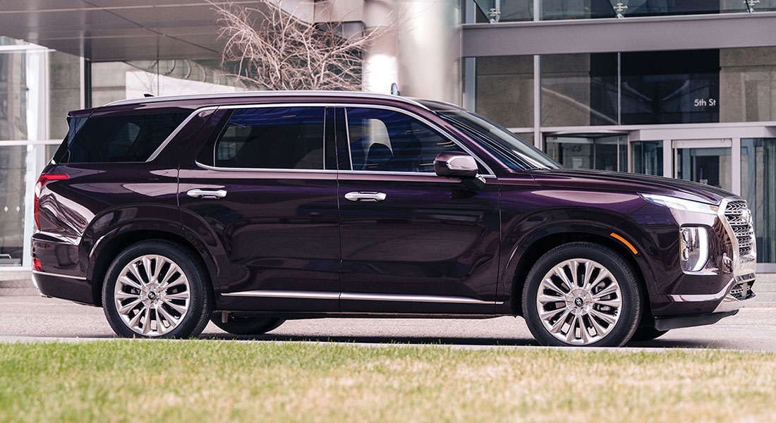 Side view of a parked 2020 Palisade in burgundy