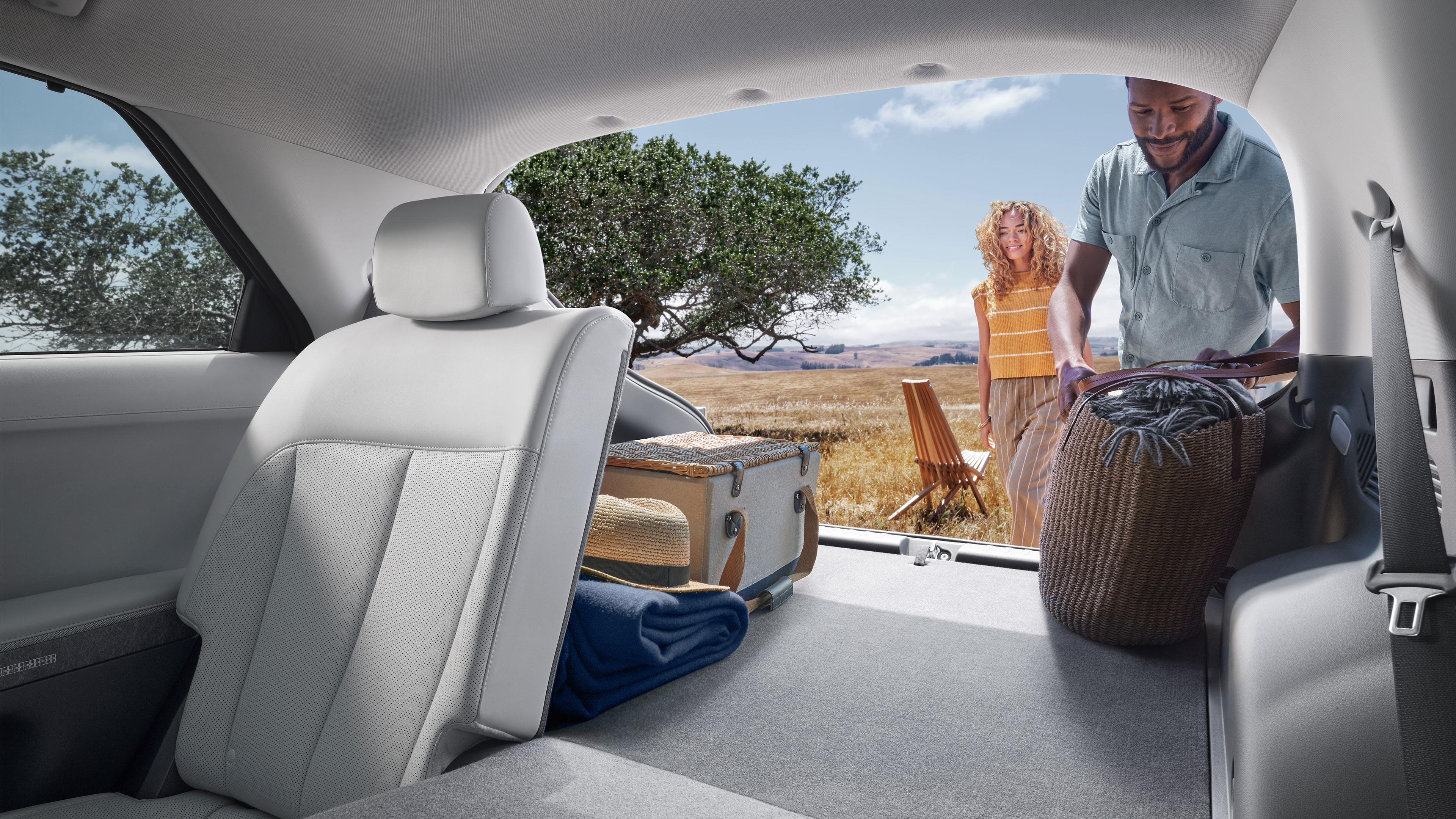 Cargo space of the 2022 IONIQ 5 showing the 60/40 split folded down rear seats