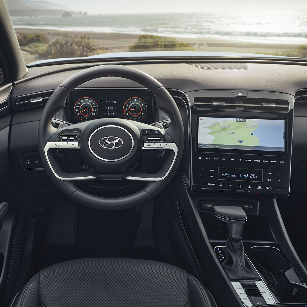 Leather-wrapped steering wheel in the front cabin of the 2022 Santa Cruz