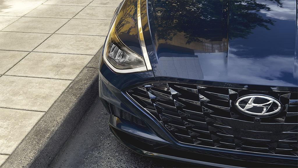 Front grille of a parked 2022 Sonata in blue