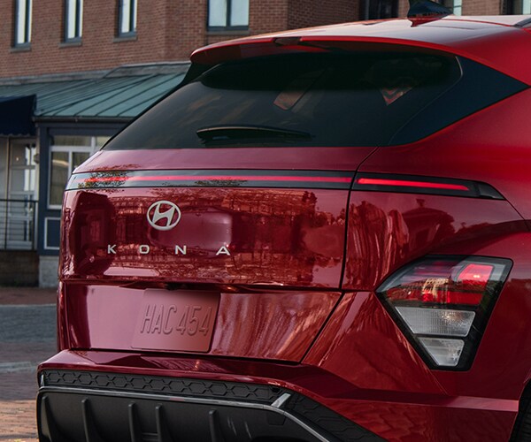 Rear exterior view of a 2026 Kona with standard LED headlights and tail lights
