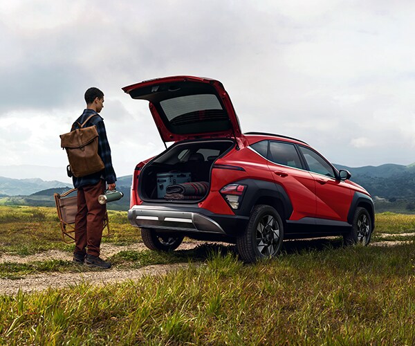 Man demonstrating use of the 2026 Kona's standard hands free smart power liftgate
