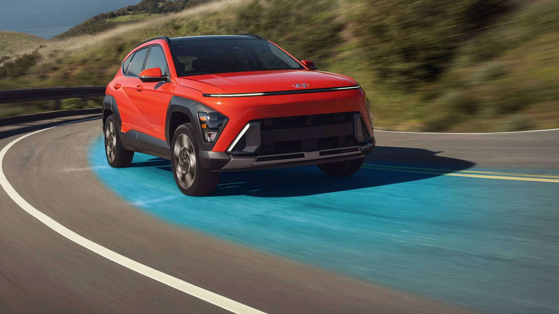 A 2027 Hyundai Kona drives along a highway using its available Highway Driving Assist